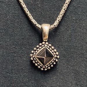 Silver and black stone pendant